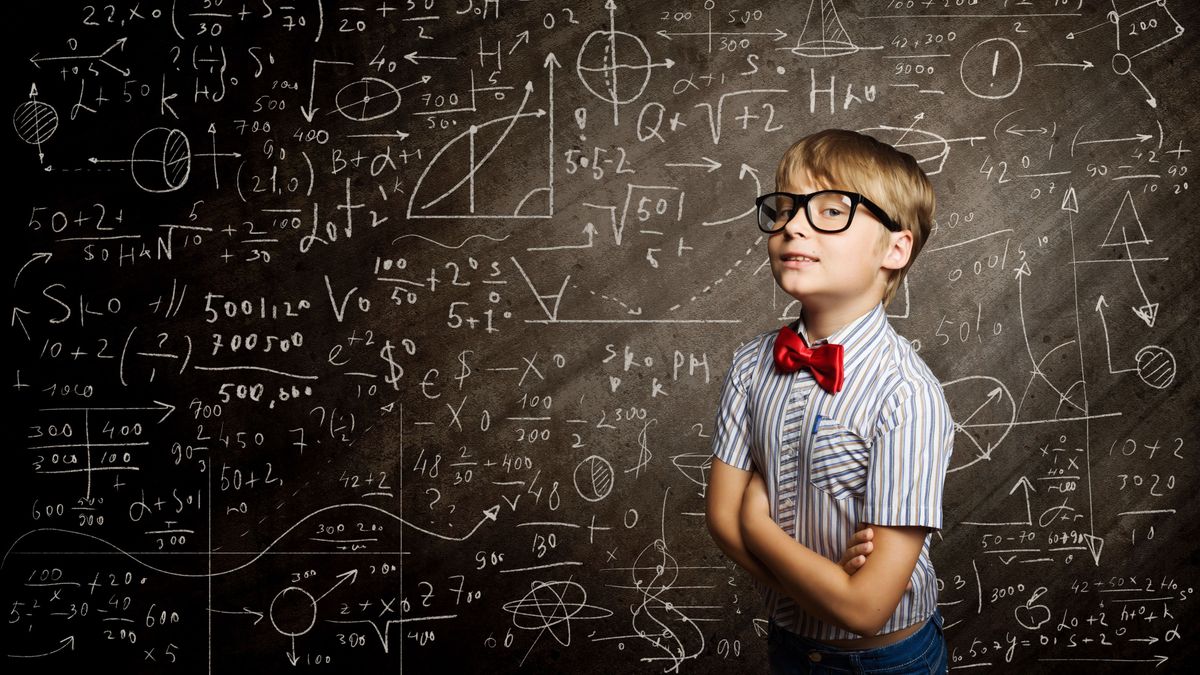 Genius,Boy,In,Red,Glasses,Near,Blackboard,With,Formulas
