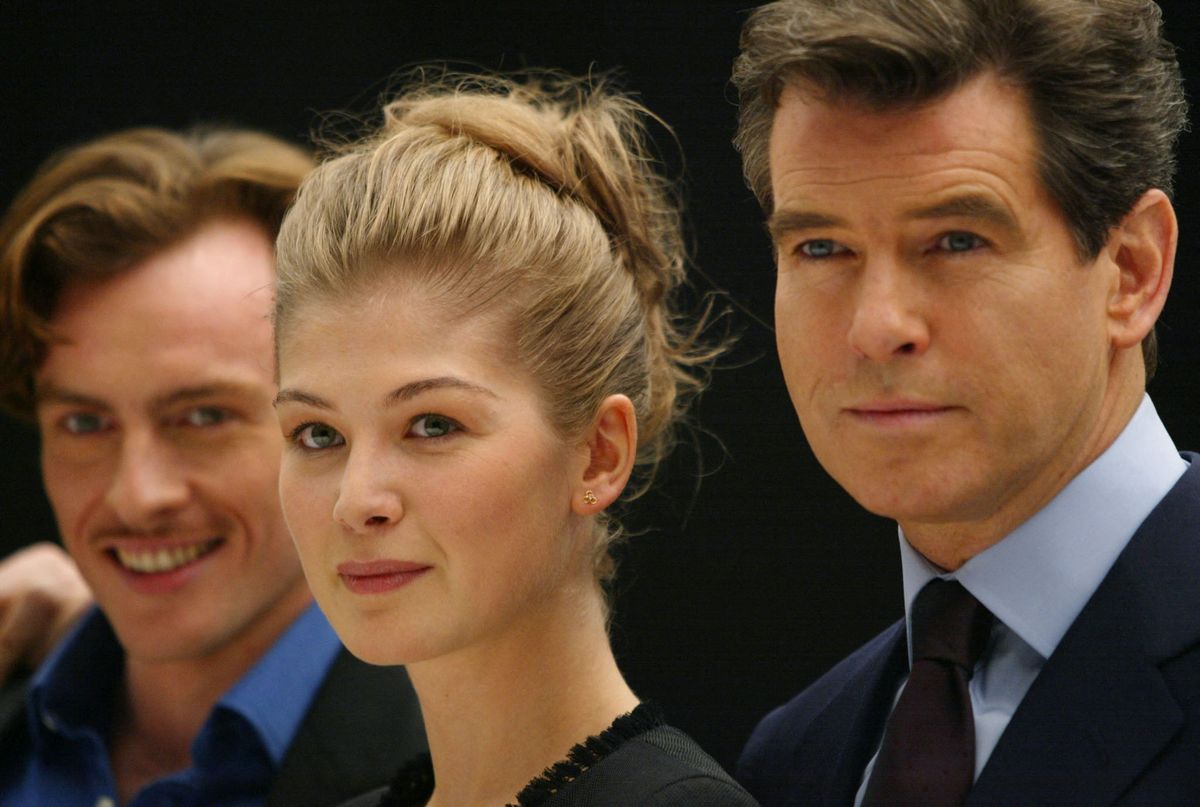 JAMES BOND 
Pierce Brosnan (R) poses with Rosamund Pike (C) and Toby Stephens (L)