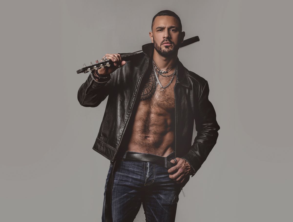 Brutal,Attractive,Bearded,Biker,Man,With,Tattooed,Poses,In,Black