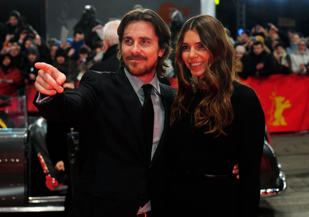 British actor Christian Bale and his wife Sandra Blazic pose for photographers at the premiere for the film "The Flowers of War" (Jin ling Shi San Chai) at the Berlinale film festival on February 13, 2012 in Berlin. The 62nd Berlinale, the first major European film festival of the year, kicked off on February 9, 2012, with 23 productions screening in the main showcase. Eighteen pictures will vie for the Golden Bear top prize at the event running to February 19.    AFP PHOTO /  JOHN MACDOUGALL