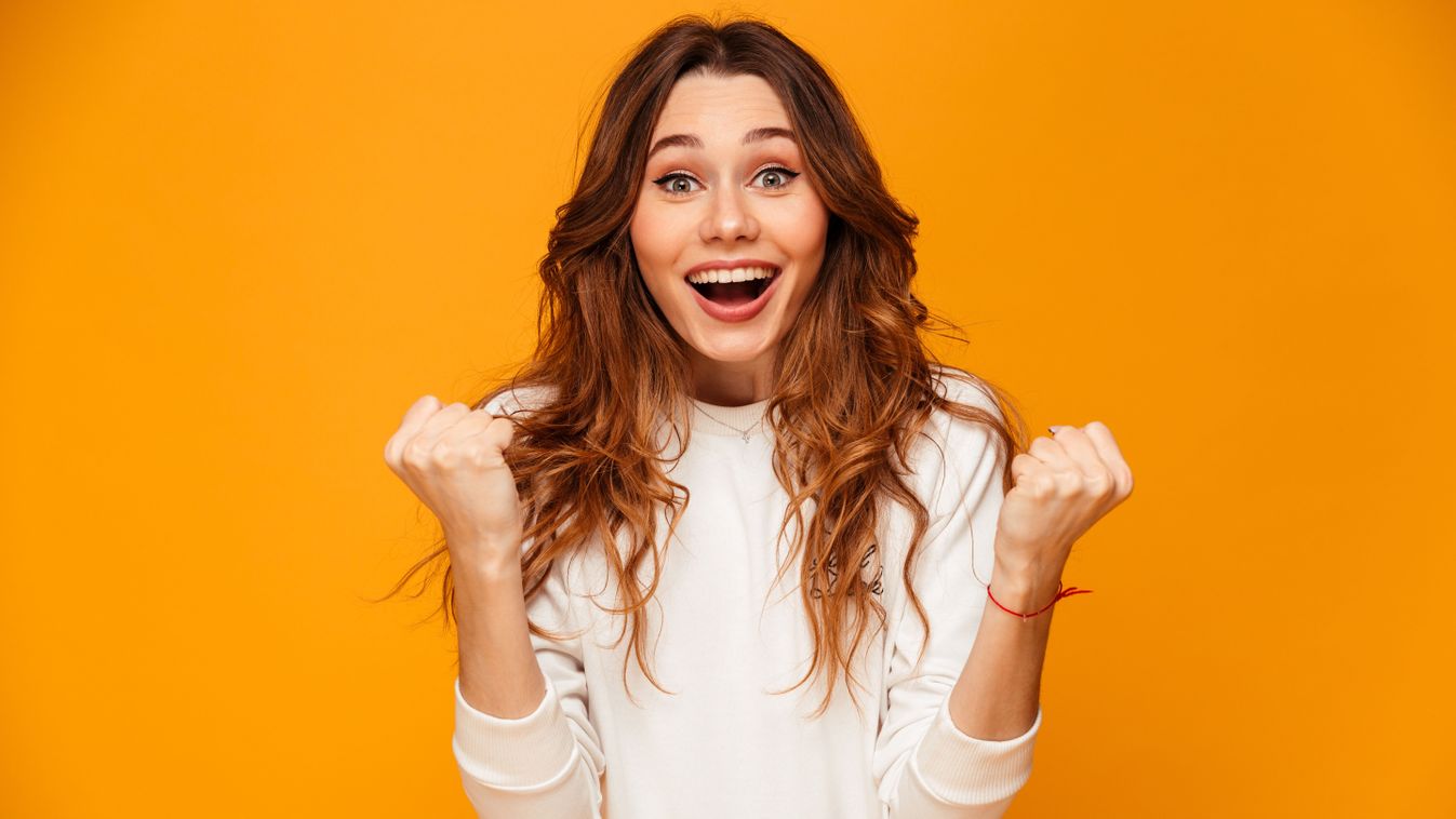 Surprised,Happy,Brunette,Woman,In,Sweater,Rejoices,And,Looking,At