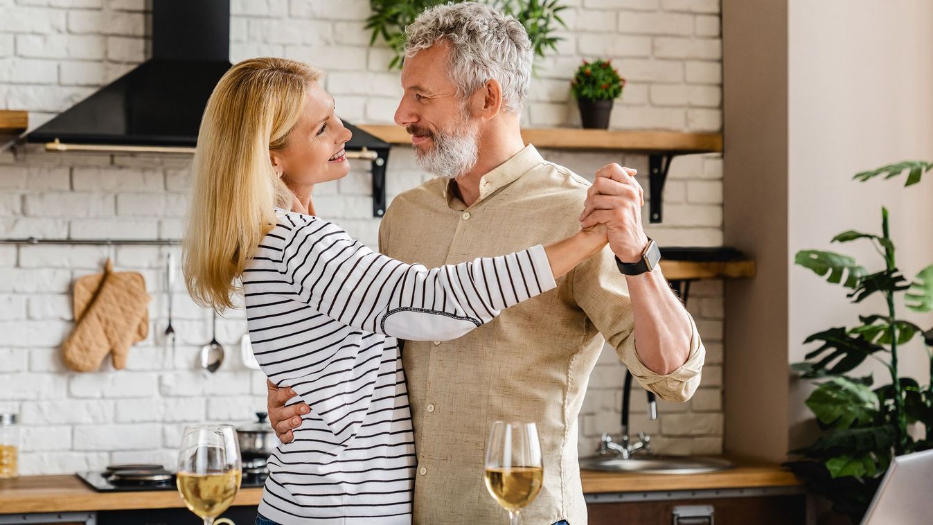 Middle,Aged,Couple,Dancing,At,Home,Kitchen