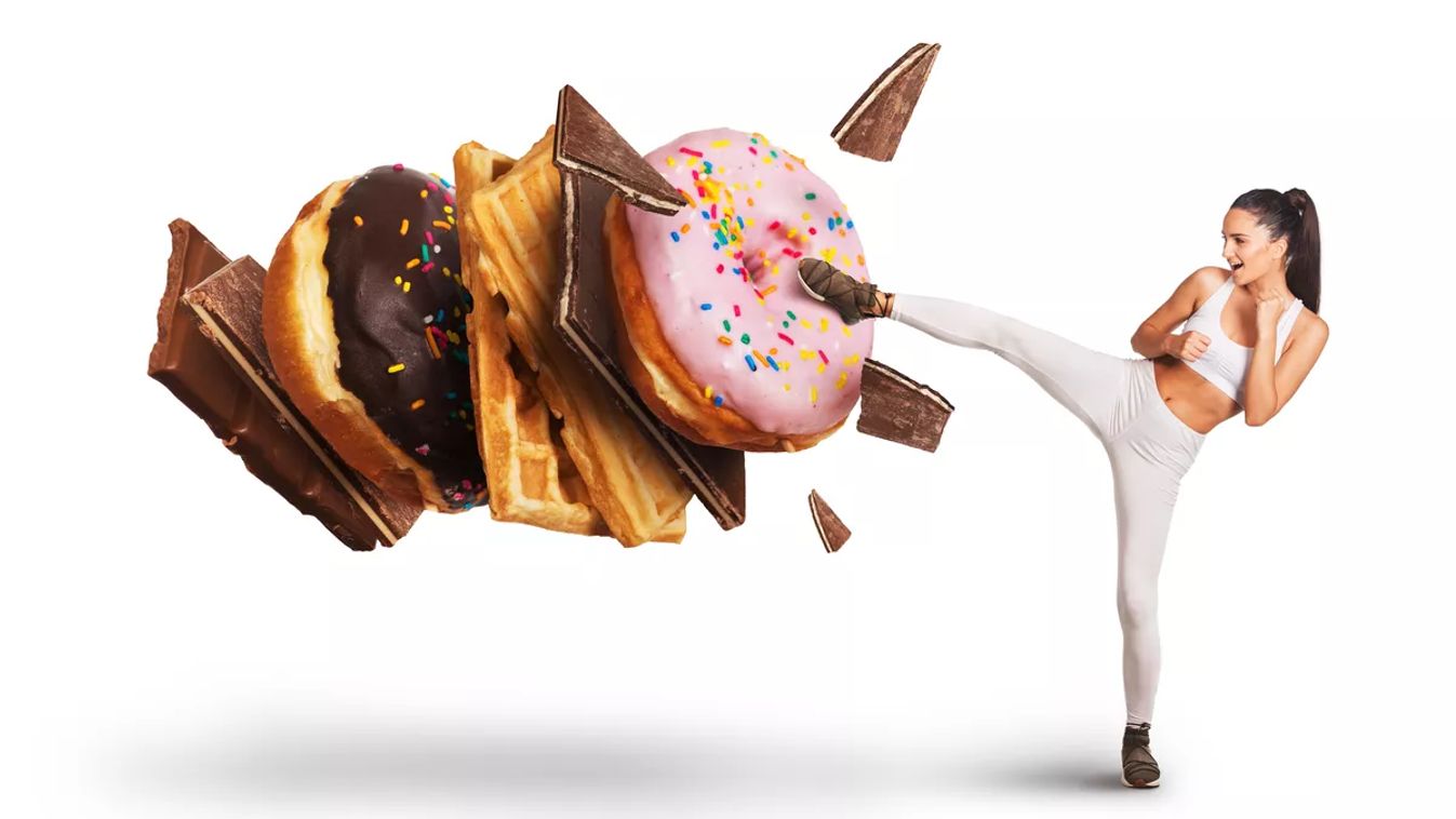 Fit,Young,Woman,Fighting,Off,Sweets,And,Candy