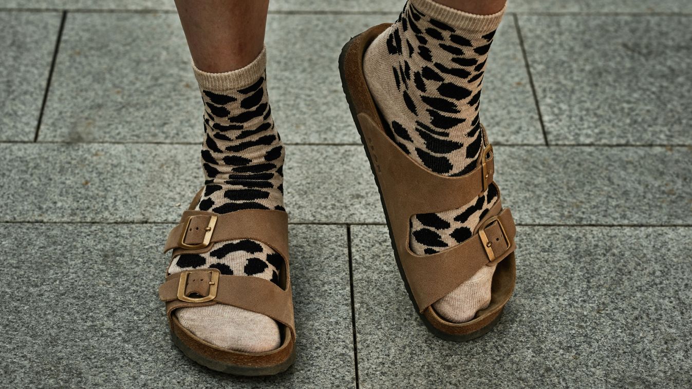 Female,Legs,In,Beige,Leopard,Socks,And,Brown,Sandals,On