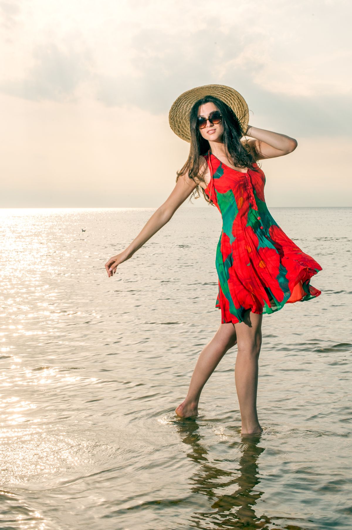 Girl,In,A,Summer,Dress,And,Straw,Hat,Dancing,On