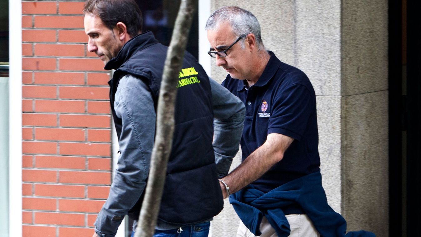 A member of the Guardia Civil escorts journalist Alfonso Basterra while Spanish detectives search his home in Santiago de Compostela on September 26, 2013 as they probed the suspected killing of her adopted Chinese-born, 12-year-old daughter. Police said they had detained Rosario Porto, 44, and journalist Alfonso Basterra, 49, on suspicion of homicide after their daughter's body was found at 1:30 am September 22 in woodland near the northwestern city of Santiago de Compostela. According to Spanish media reports, a couple heading to a nightclub discovered the body of the girl, Asunta Yong Fang Basterra Porto, just hours after she had been reported missing by her parents.  