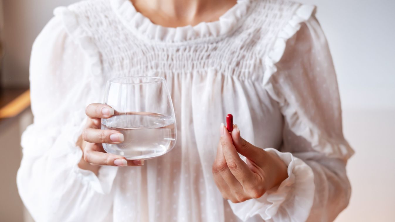 Woman,In,White,Blouse,Holding,In,Hand,Iron,Ferrum,Supplement