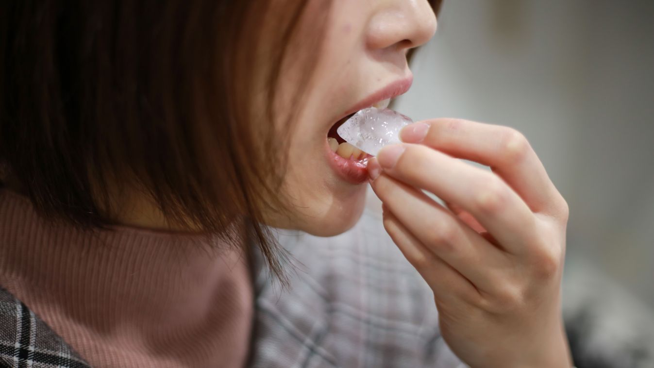 Image,Of,A,Woman,Eating,Ice