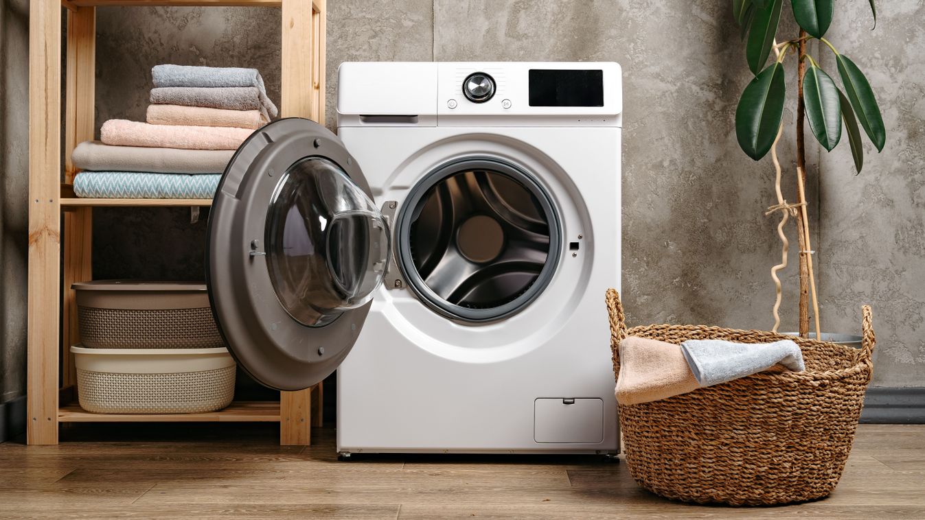 Laundry,Room,Interior,With,Washing,Machine,Near,Gray,Grunge,Wall