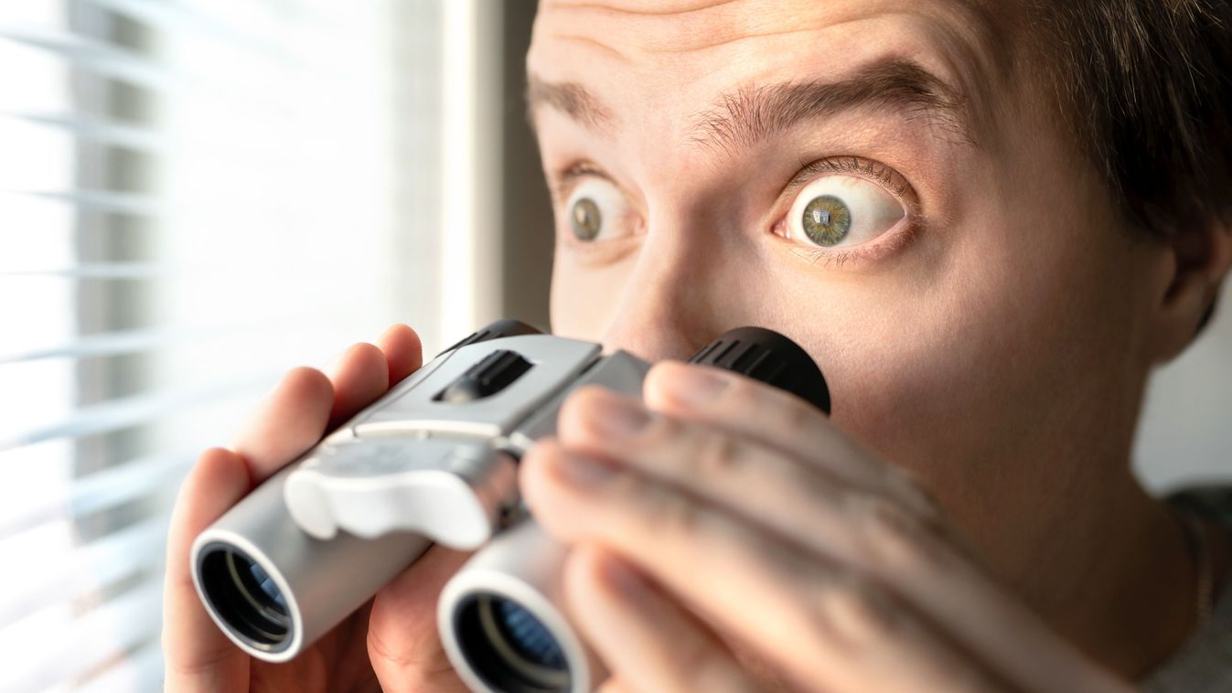 Surprised,Man,With,Binoculars.,Curious,Guy,With,Big,Eyes.,Nosy