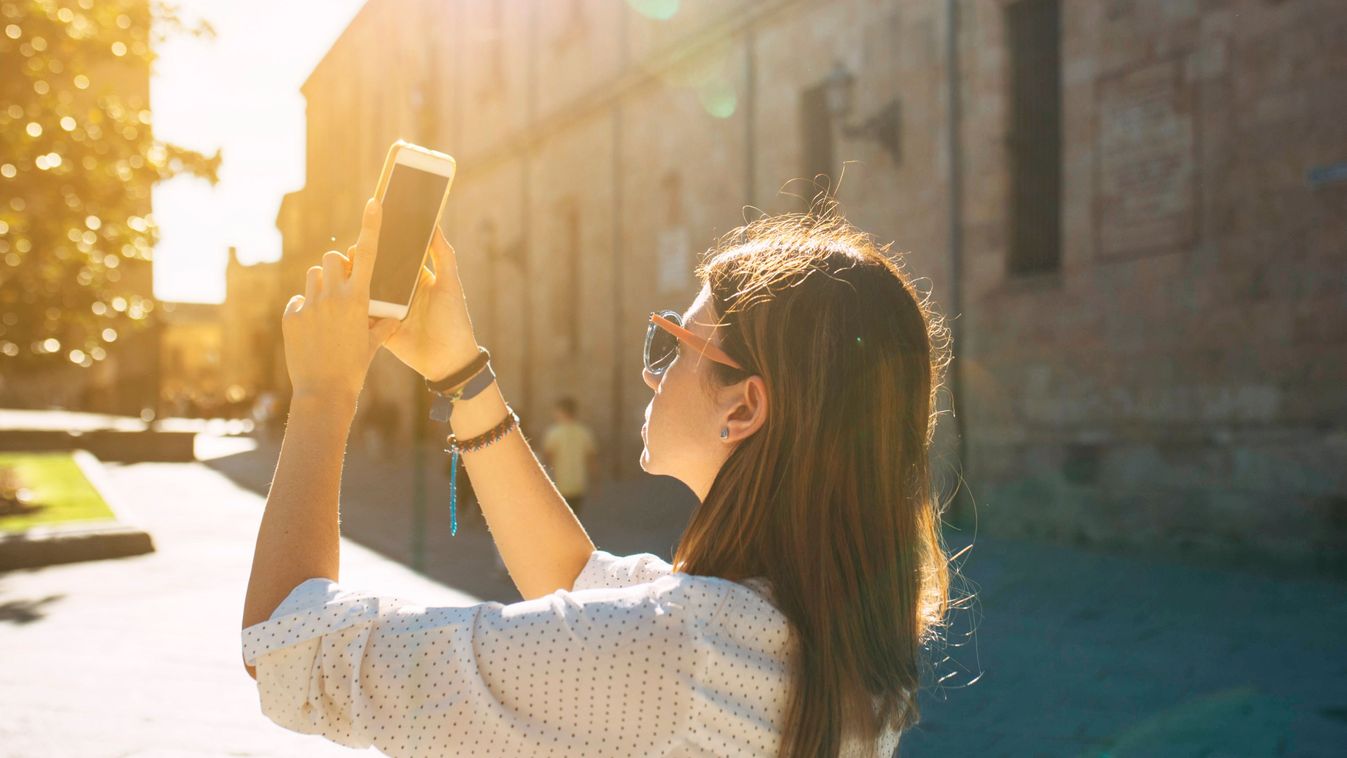 Young,Woman,Turist,Visiting,An,Ancient,City,In,Spain,Taking