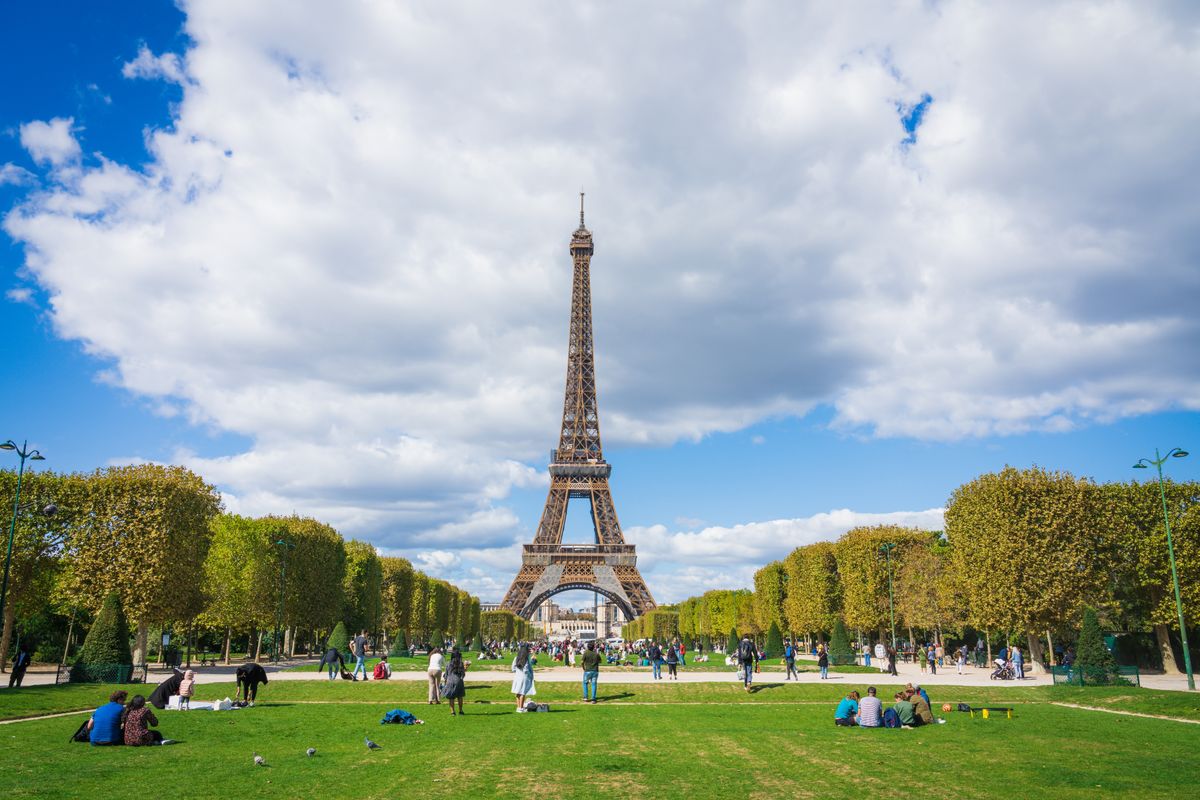 Champ,De,Mars,Park,With,Tourists,Overlooking,Eiffel,Tower,In