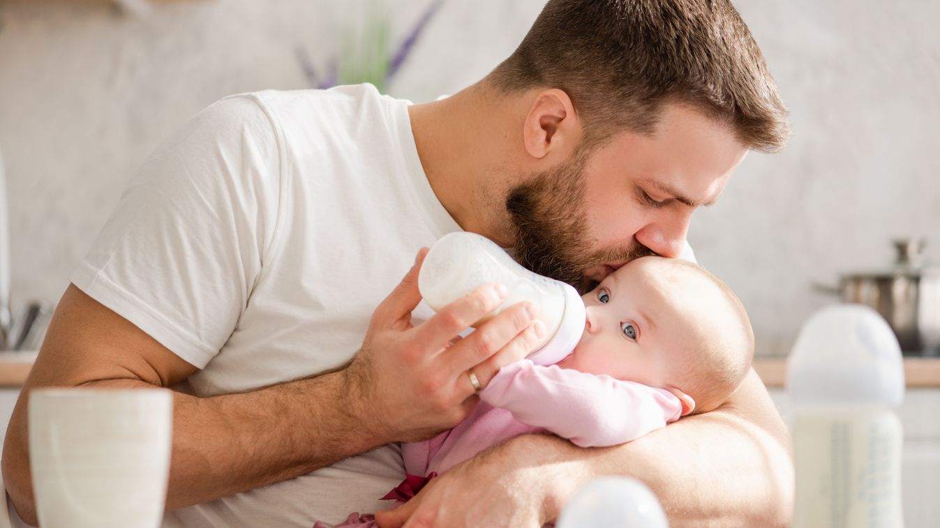 Young,Father,Kiss,His,Baby,During,Drinking,Milk