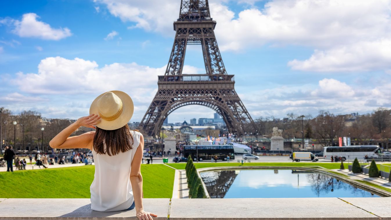 A,Tourist,Woman,Enjoys,The,Beautiful,View,Of,The,Eiffel