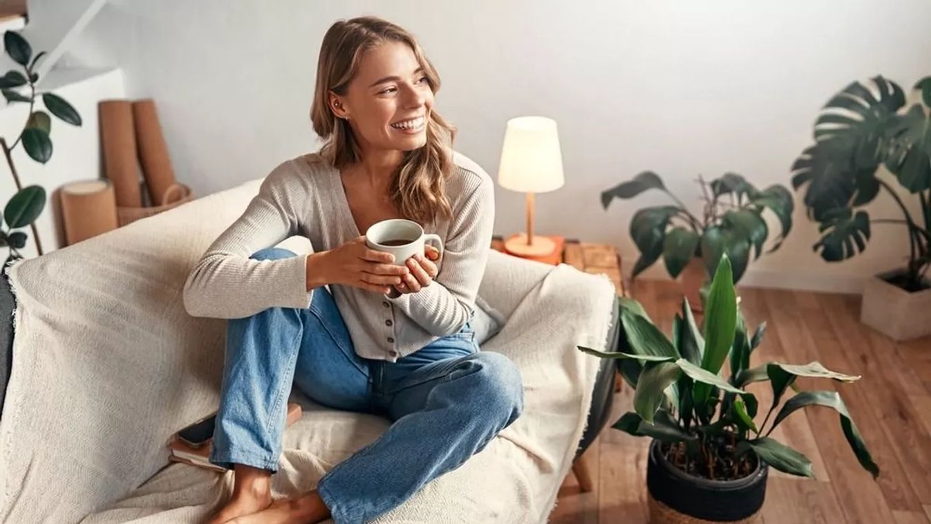 Young,Woman,With,A,Cup,Of,Hot,Coffee,Or,Tea