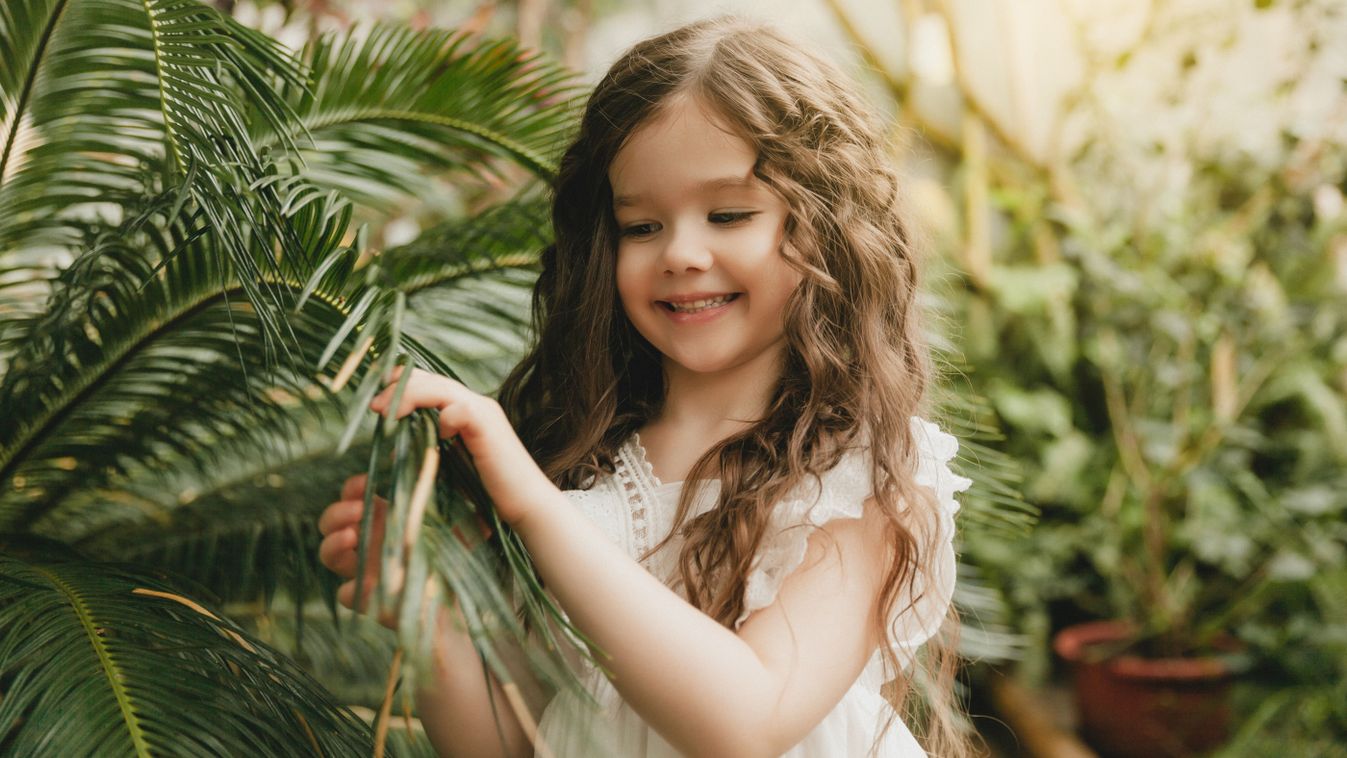 Little,Girl,In,The,Botanical,Garden.,A,Girl,In,A