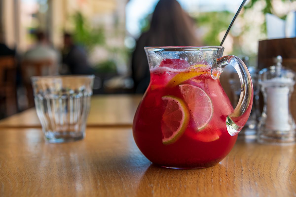 Close-up,Side,View,Of,Glass,Pitcher,With,Red,Fruit,Lemonade