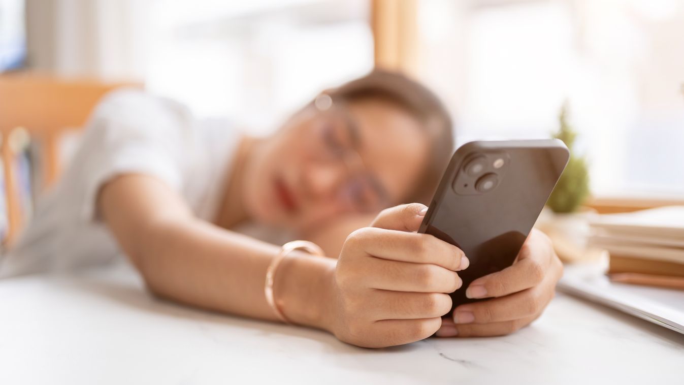 A,Tired,,Bored,Young,Asian,Woman,Leaning,On,The,Table