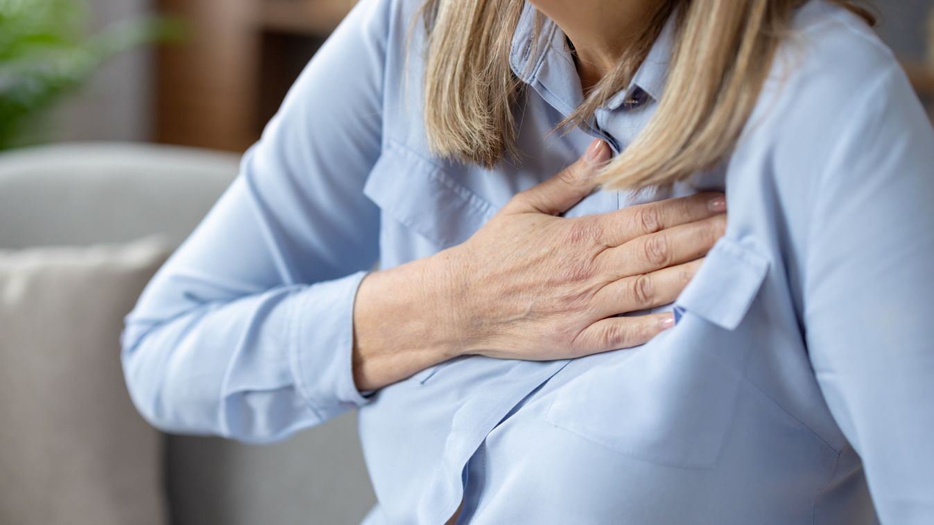 Close-up,Image,Of,A,Senior,Woman,Experiencing,Discomfort,And,Holding