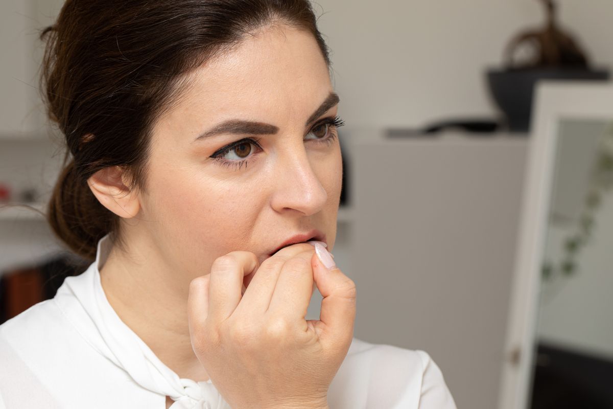 Portrait,Of,A,Girl,Biting,Her,Nails,In,A,Compulsive