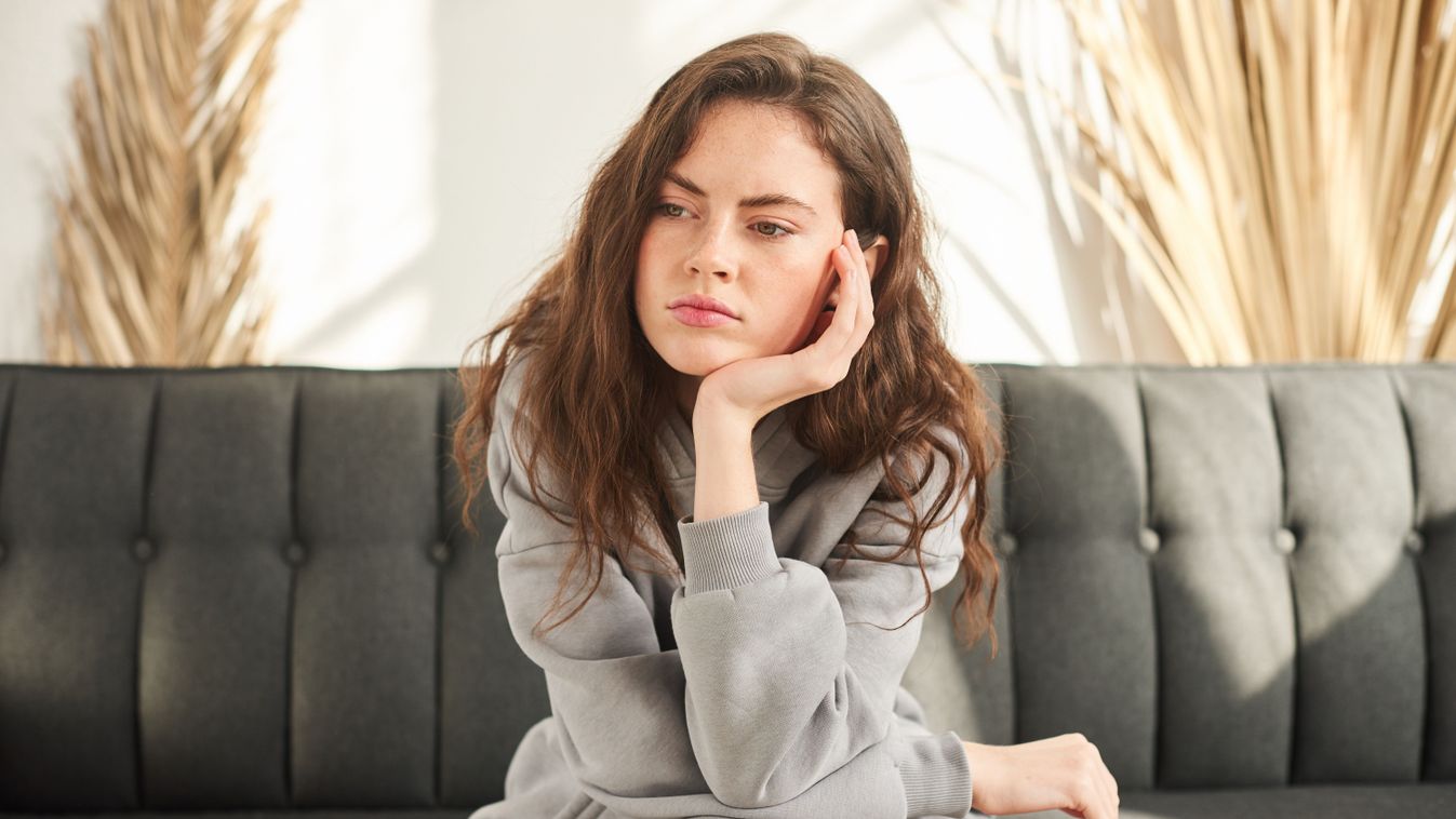 Bored,And,Sad,Woman,Sitting,On,Couch,With,No,Mood