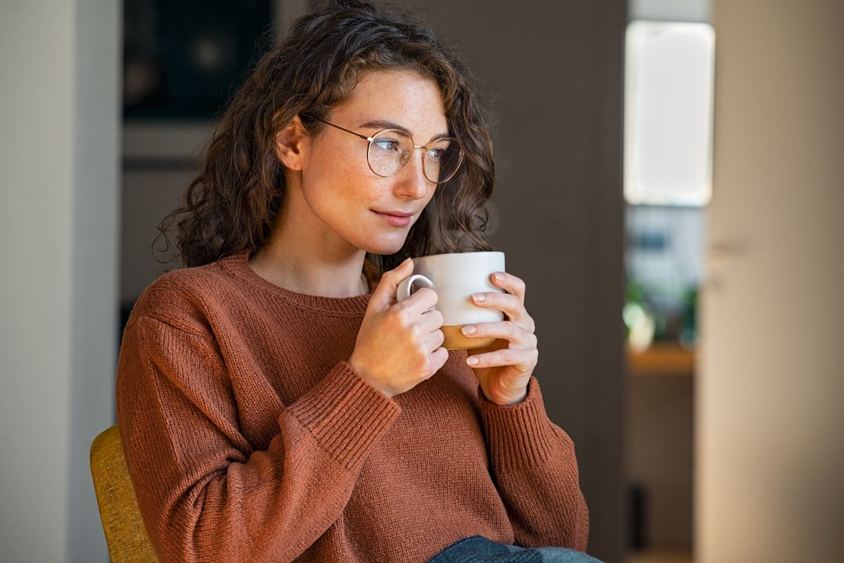 Pensive,Woman,Drinking,Hot,Coffee,At,Home.,Thoughtful,Young,Woman