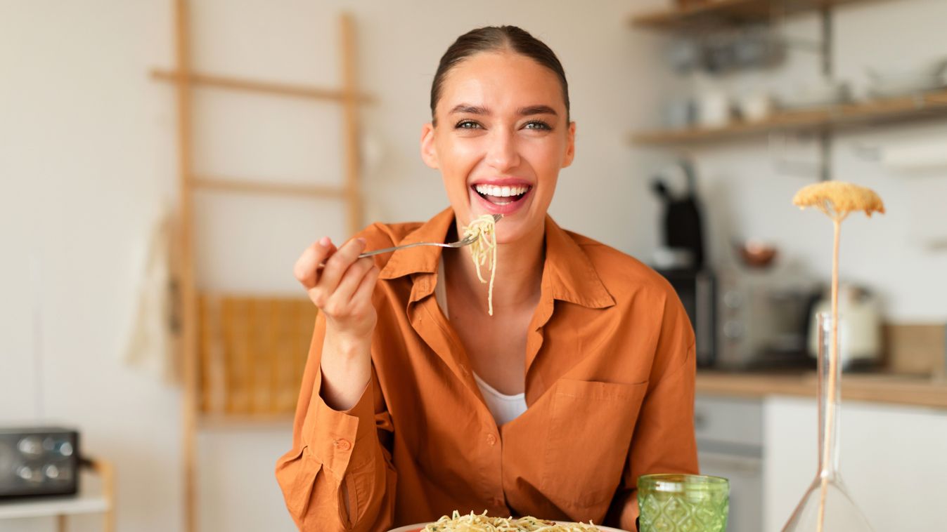 Happy,Young,European,Lady,Eating,Delicious,Homemade,Italian,Pasta,,Enjoying