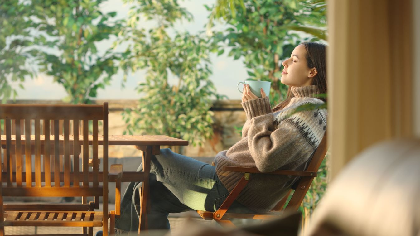 Profile,Of,A,Woman,In,A,House,Terrace,Drinking,Coffee