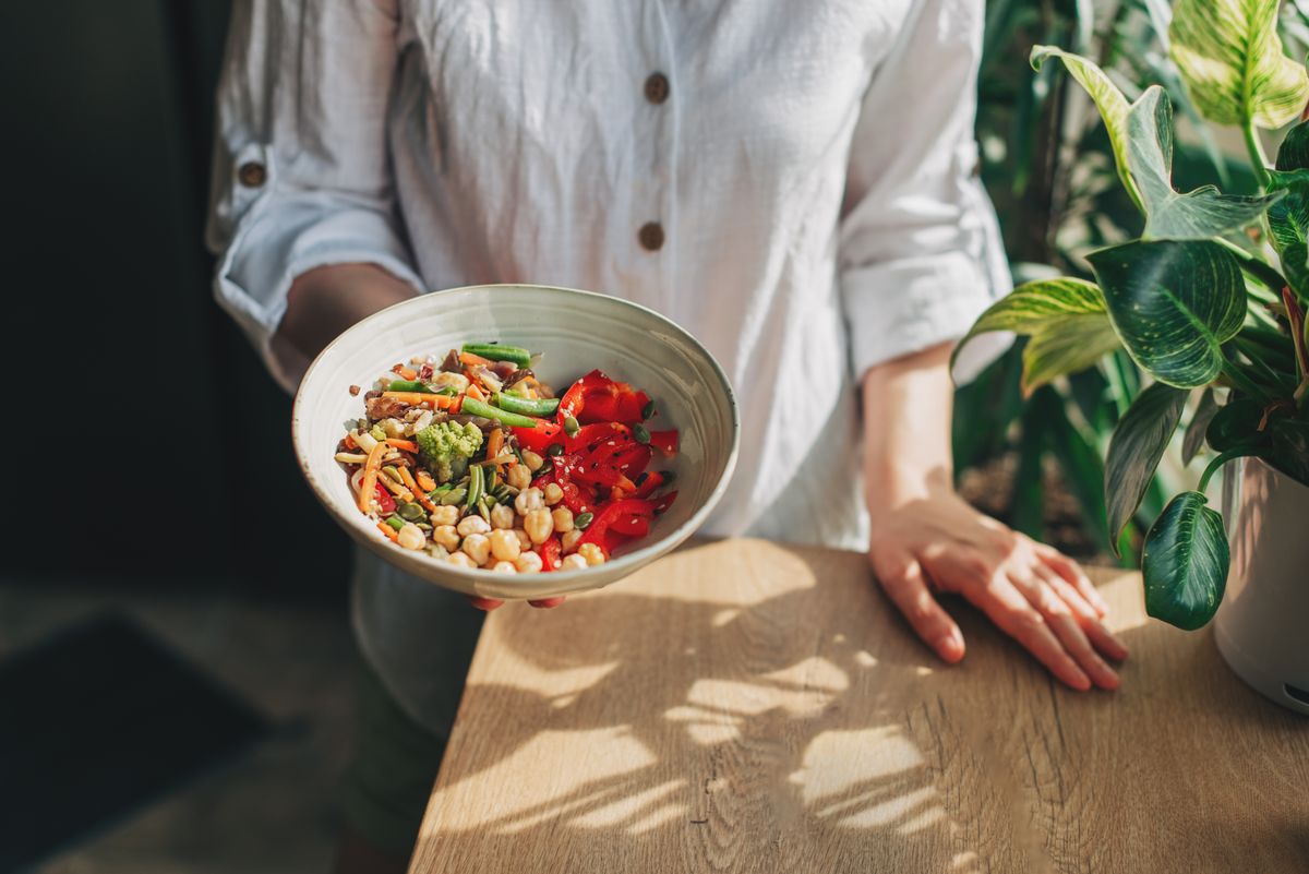 Young,Woman,Eating,Healthy,Food,Sitting,In,The,Beautiful,Interior