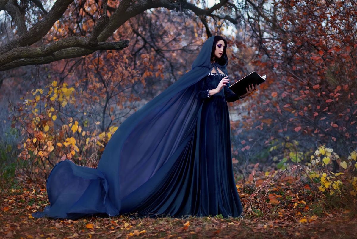 Art,Photography.,Woman,Witch,Holds,Book,In,Hands,Reads,Spell.