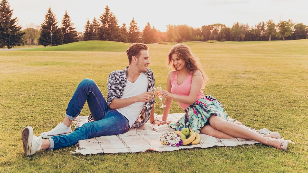 Cheers!,Young,Man,And,Woman,At,Picnic