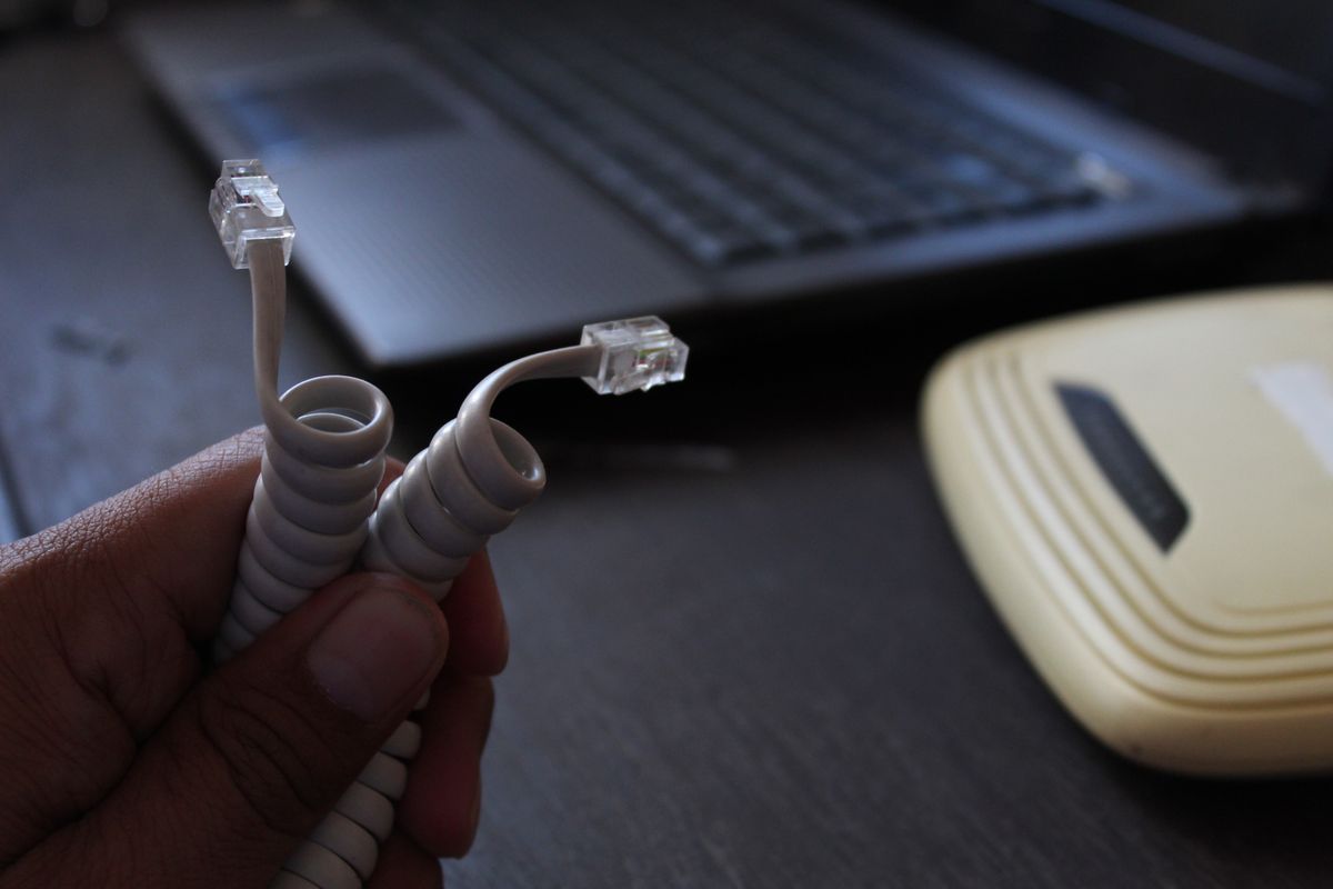 Telephone,Cable,Closeup,,Isolated,On,Blurry,Background,Of,Computer,Network