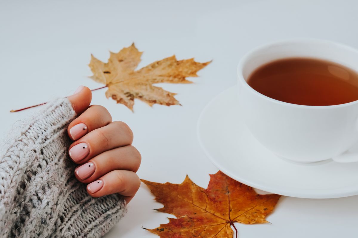 Woman,Hands,With,Beautiful,Nude,Manicure,Holding,Autumn,Leaves.,Female