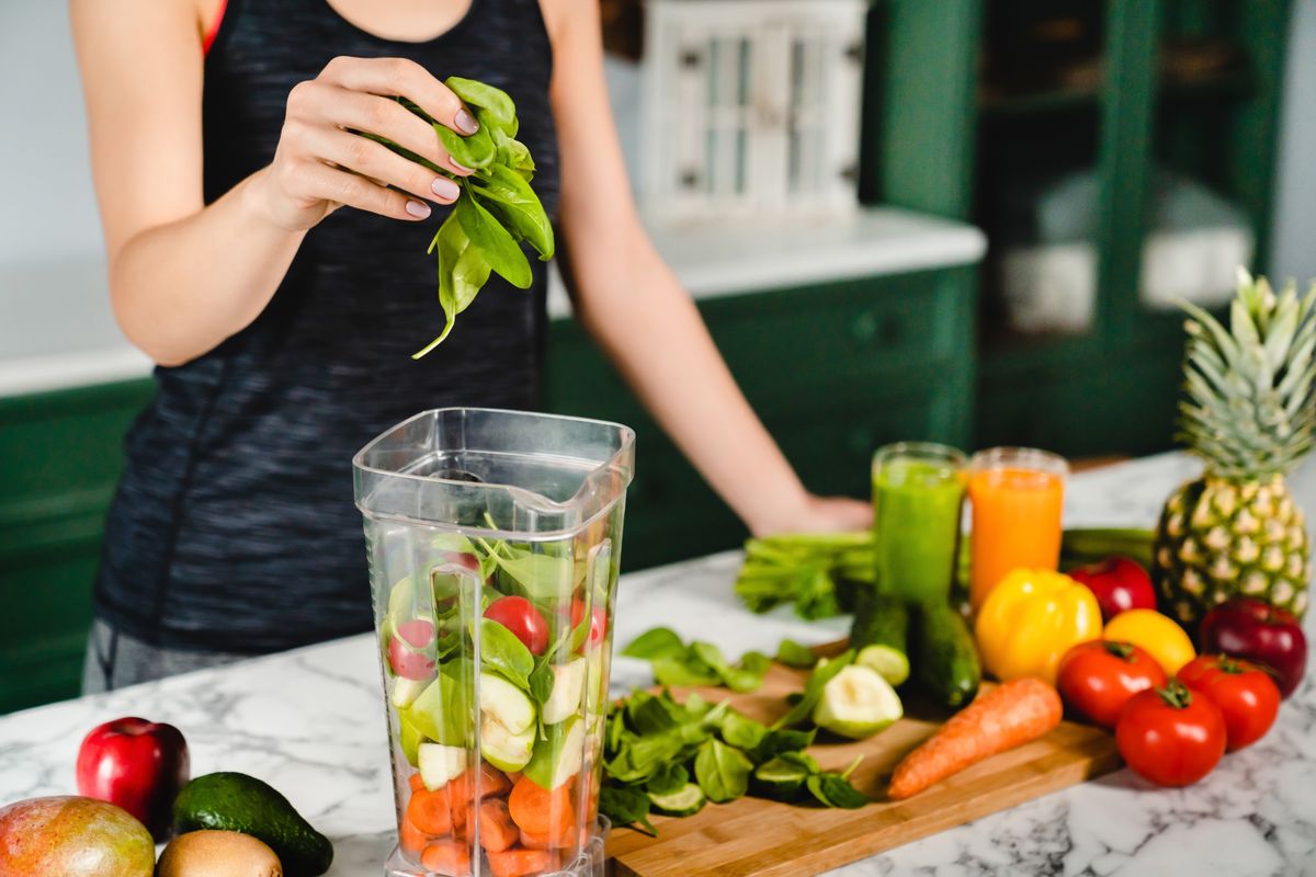 Young,Girl,Making,Green,Detox,Cocktail,Of,Fresh,Vegetables,And