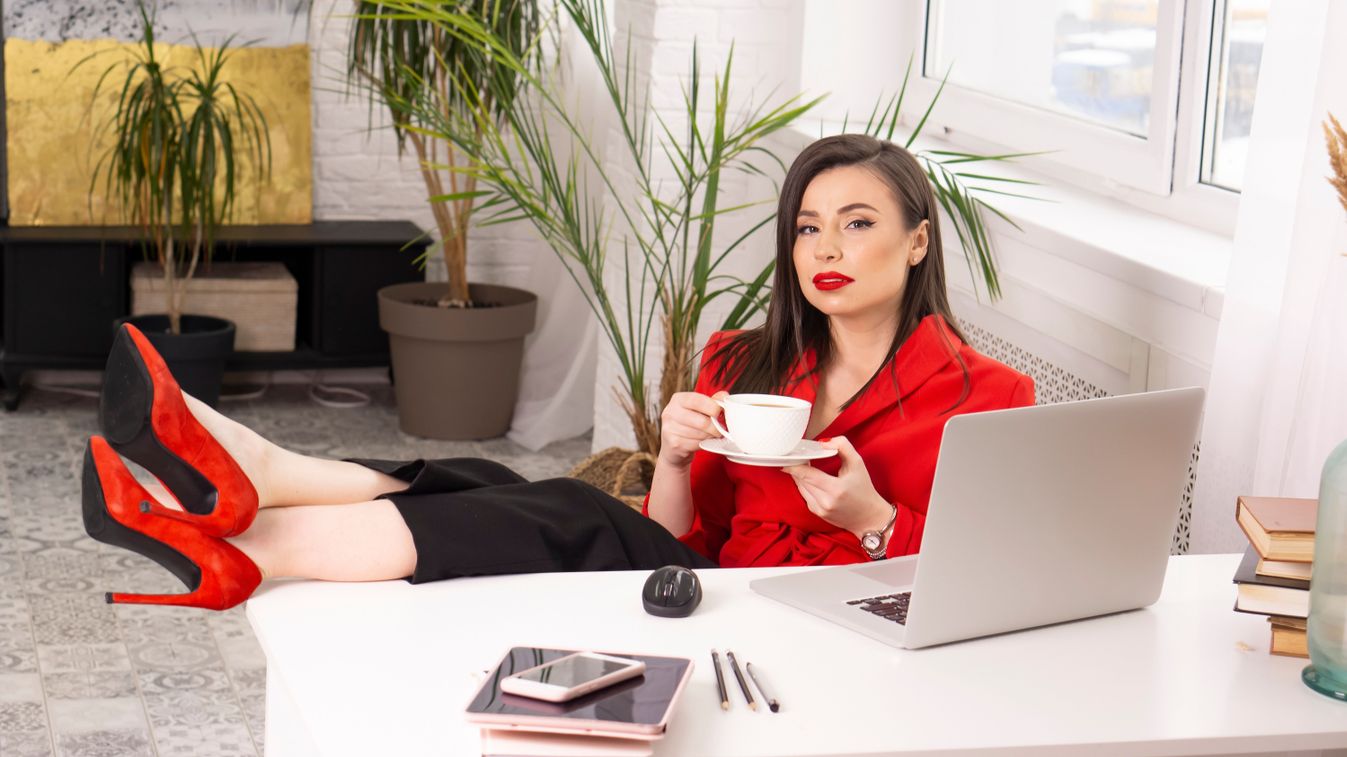 Young,Woman,In,A,Red,Blazer,Relaxing,In,The,Office