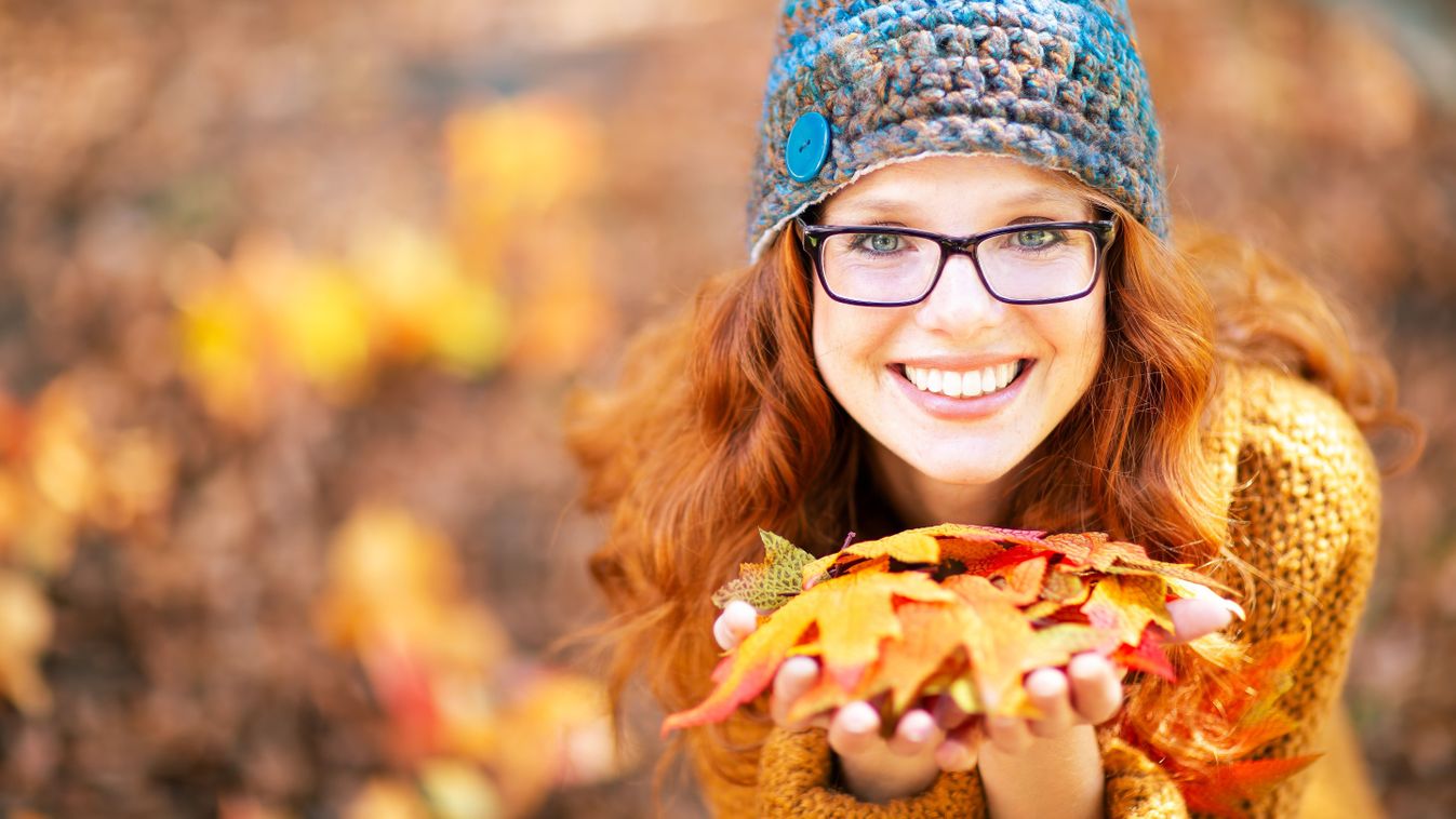 A,Young,Woman,With,Red,Hair,And,Glasses,,Wearing,A