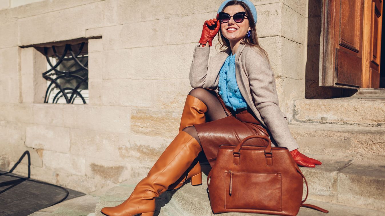 Portrait,Of,Woman,Wearing,Stylish,Orange,Boots,Coat,Beret,Sitting