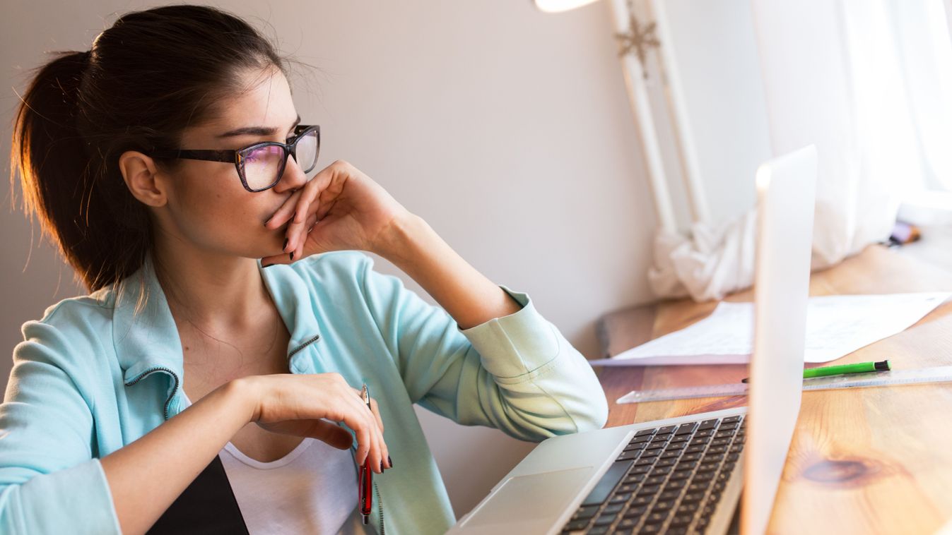 Young,Female,Student,Working,At,Home.she,Sitting,In,Her,Working