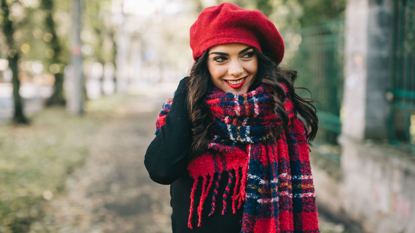 A,Beautiful,Woman,In,A,Red,Scarf,And,Hat,Walks