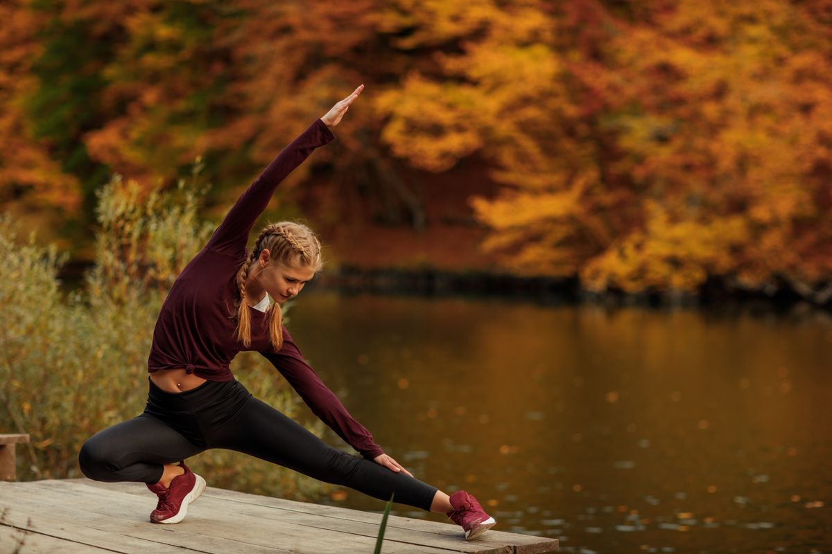 A,Young,Beautiful,Woman,Is,Doing,Exercises,In,The,Autumn