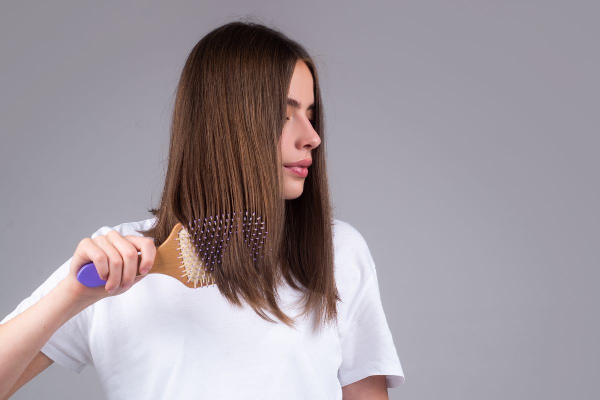 Young,Beautiful,Woman,Combing,Brown,Hair.,Hair,Care.,Beautiful,Brunette