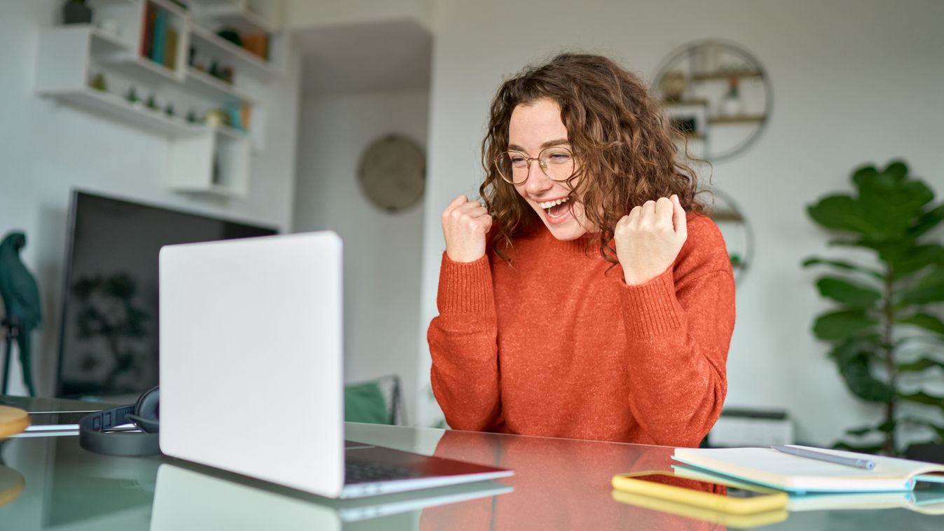 Happy,Girl,Student,Winner,Looking,At,Laptop,Receiving,Good,News