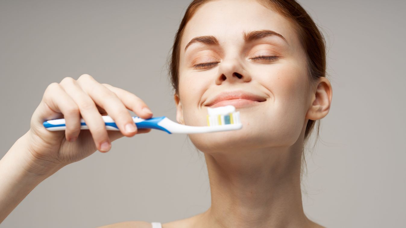 Woman,Holding,A,Toothbrush,In,Her,Hand,A,Pleasant,Aroma