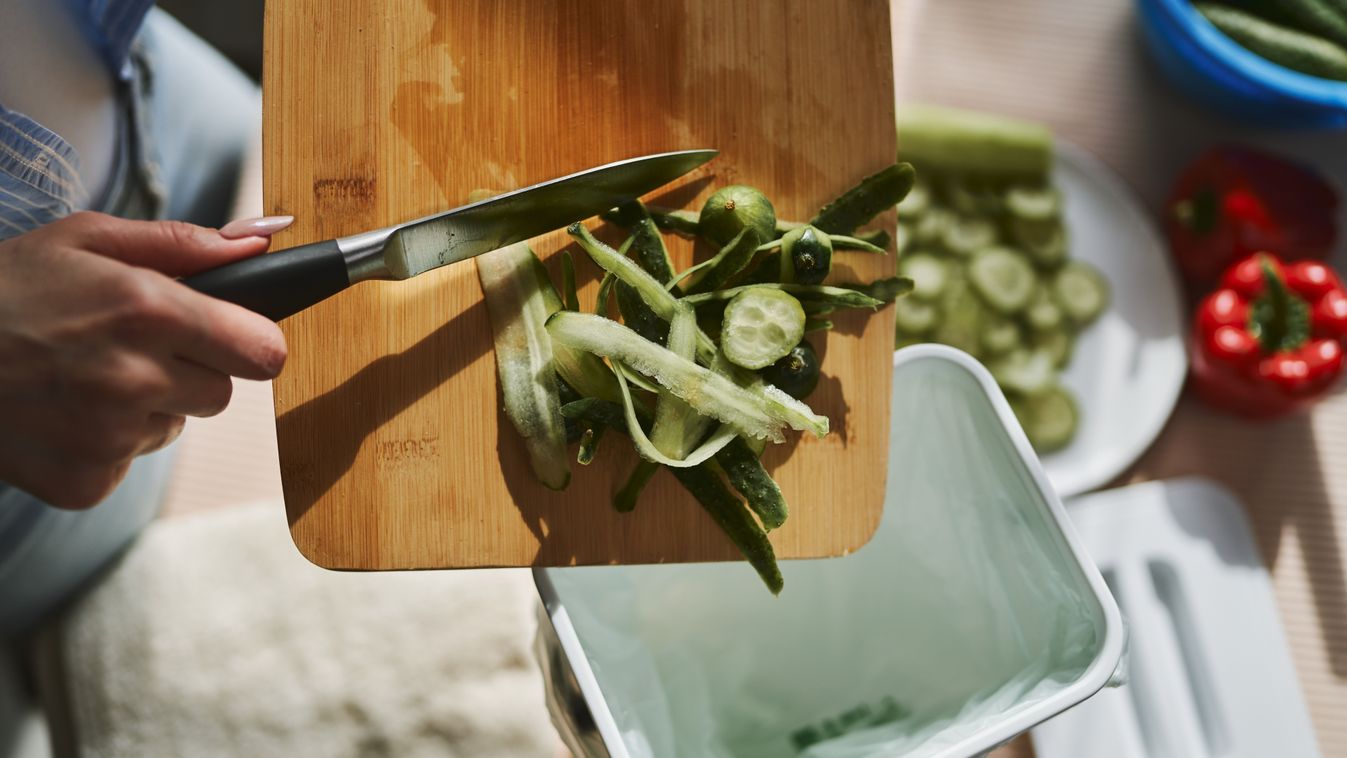 Woman,Throwing,Organic,Food,Waste,In,A,Compost,Bin.,Female