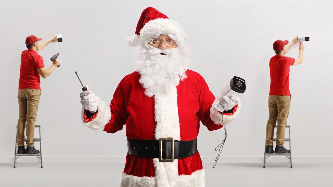 Team,Of,Technicians,Installing,Security,Cameras,And,Santa,Claus,Holding