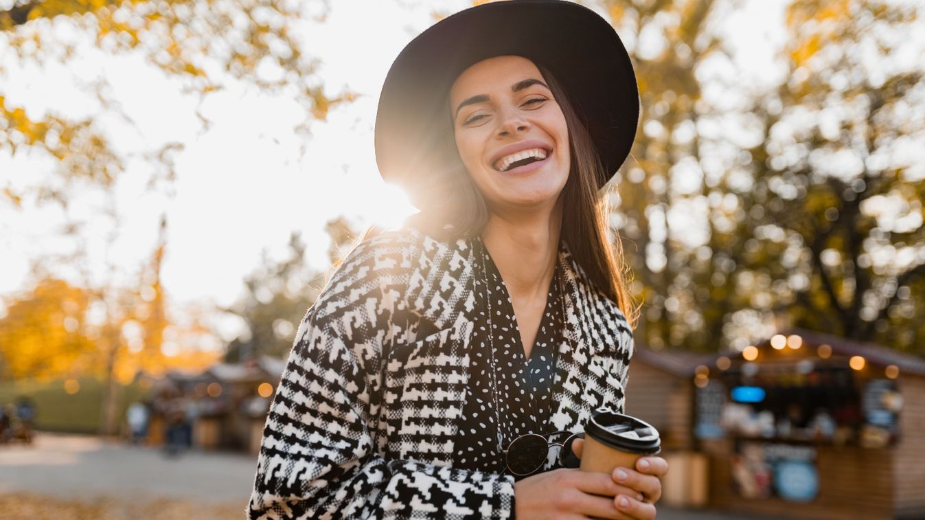 Attractive,Young,Woman,Walking,In,Autumn,Street,Wearing,Checkered,Coat,