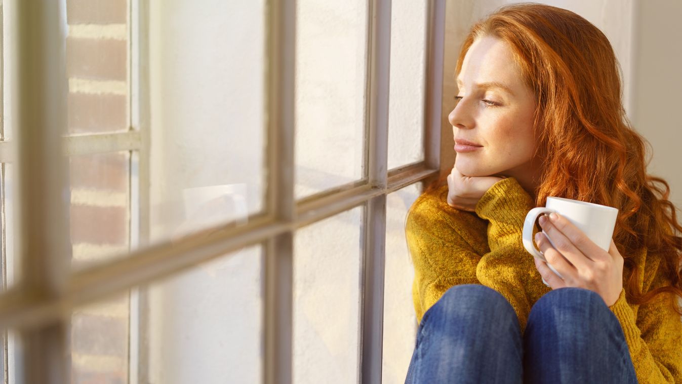 Pretty,Redhead,Woman,Savoring,Her,Mug,Of,Hot,Coffee,As