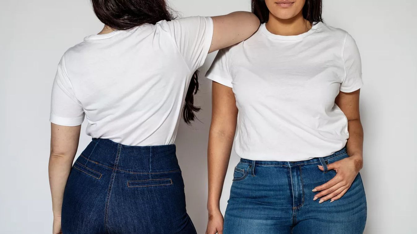 Two women standing in opposite directions