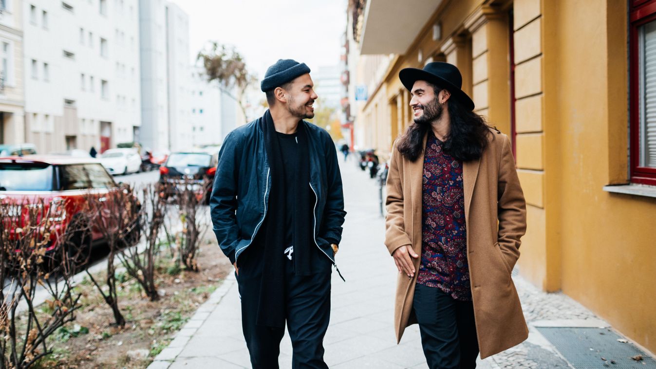 Two Friends On Their Way To Bar Together