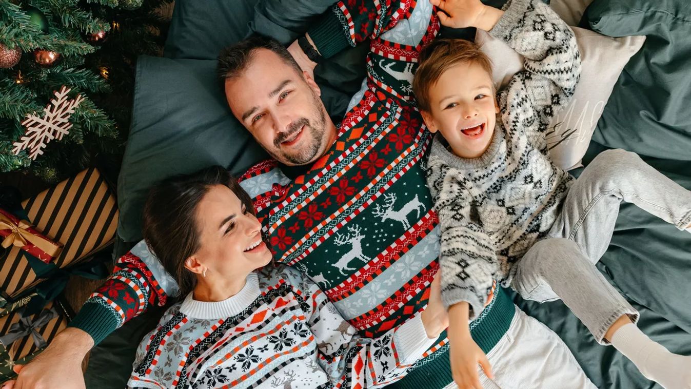 Happy,Family,Near,Fir-tree,In,Bedroom,,Christmas,Celebration,At,Home